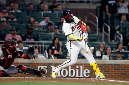 Harris and Ozuna deliver clutch hits as Braves rally past slumping Reds 2-1 in 10 innings