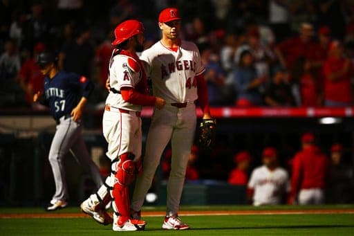 Los Angeles Angels pitcher Ben Joyce, right, is greeted by catcher Travis D'Arnaud after defeating the Seattle Mariners in a baseball game, Monday, Sept. 14, 2026, in Anaheim, Calif. (AP Photo/William Liang) (AP Photo/William Liang)