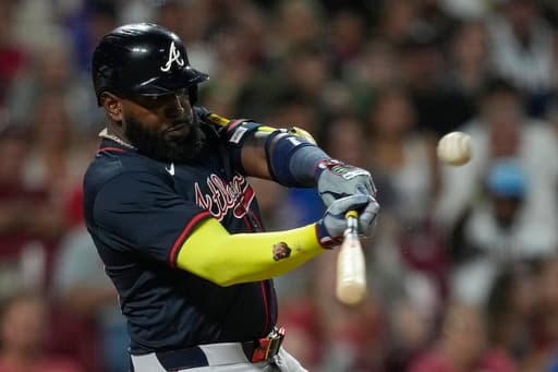 Ozuna’s sacrifice fly in 10th gives Braves 12-11 win over Reds