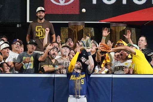 Milwaukee Brewers center fielder Garrett Mitchell catches a ball hit by San Diego Padres' Manny Machado during the eighth inning in Game 4 of baseball's National League Division Series Wednesday, Oct. 7, 2026, in San Diego. (AP Photo/Gregory Bull) (AP Photo/Gregory Bull)