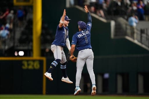 Tampa Bay Rays' Taylor Walls, left, and Richie Palacios (1) celebrate the team's win during a baseball game against the Texas Rangers Friday, Sept. 4, 2026, in Arlington, Texas. (AP Photo/Tony Gutierrez) (AP Photo/Tony Gutierrez)