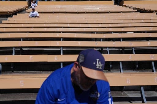 Empty seats sit under the heat before Game 1 of a National League Division Series baseball game against the Atlanta Braves Saturday, Oct. 3, 2026, in Los Angeles. (AP Photo/Jae C. Hong) (AP Photo/Jae C. Hong)