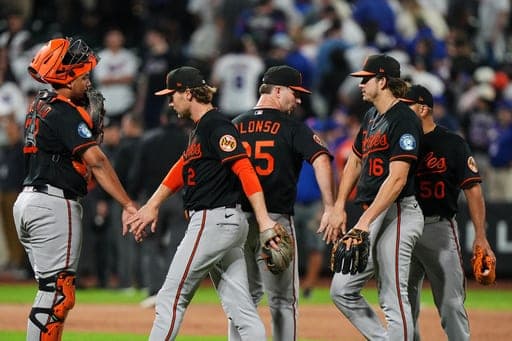Baltimore Orioles' Gunnar Henderson (2), Pete Alonso (25) and Coby Mayo (16) celebrate with teammates after a baseball game against the New York Mets Monday, Sept. 14, 2026, in New York. (AP Photo/Frank Franklin II) (AP Photo/Frank Franklin II)