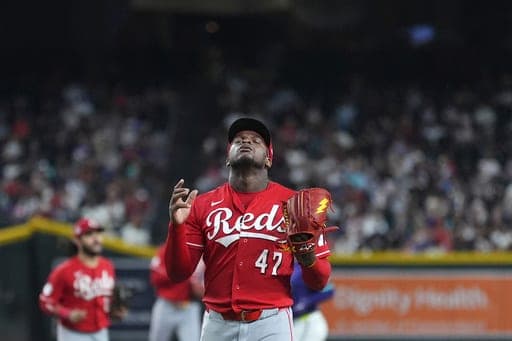 Cincinnati Reds pitcher Luis Mey looks up as he walks off the field after retiring the Arizona Diamondbacks during the seventh inning of a baseball game, Sunday, Aug. 23, 2026, in Phoenix. (AP Photo/Ross D. Franklin) (AP Photo/Ross D. Franklin)