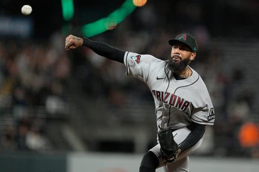 Arizona Diamondbacks pitcher Dennis Santana throws against the San Francisco Giants during the eighth inning of a baseball game in San Francisco, Friday, Aug. 28, 2026. (AP Photo/Tony Avelar) (AP Photo/Tony Avelar)