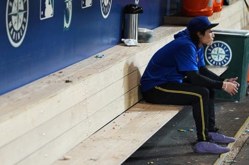 Seattle Mariners starting pitcher Bryan Woo sits in the dugout after a loss to the Los Angeles Angels in a baseball game, Thursday, Sept. 24, 2026, in Seattle. (AP Photo/Lindsey Wasson) (AP Photo/Lindsey Wasson)