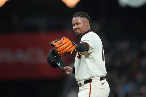 San Francisco Giants pitcher Yunior Marte gestures as he walks to the dugout during a pitching change in the fifth inning of the second baseball game of a doubleheader against the Arizona Diamondbacks, Saturday, Aug. 29, 2026, in San Francisco. (AP Photo/Jeff Chiu) (AP Photo/Jeff Chiu)