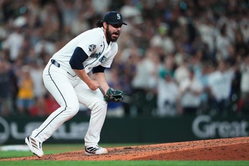 Seattle Mariners relief pitcher Andrés Muñoz reacts to earning the save in a win over the Philadelphia Phillies in a baseball game, Tuesday, Aug. 25, 2026, in Seattle. (AP Photo/Lindsey Wasson) (AP Photo/Lindsey Wasson)