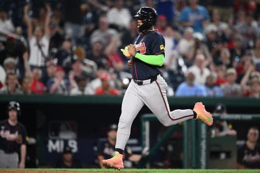 Atlanta Braves' Ronald Acuna Jr. runs towards home to score on a wild pitch by Washington Nationals relief pitcher Clayton Beeter during the eighth inning of a baseball game, Tuesday, Sept. 1, 2026, in Washington. (AP Photo/Nick Wass) (AP Photo/Nick Wass)
