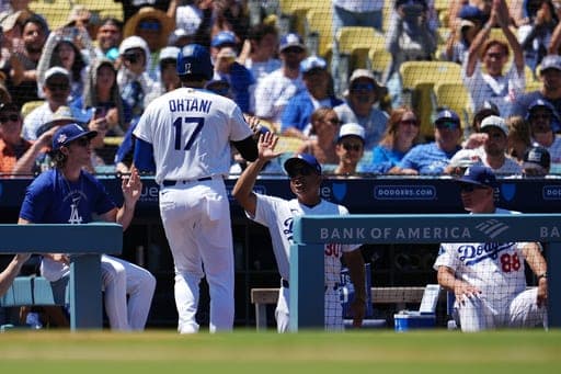 Los Angeles Dodgers' Shohei Ohtani (17) returns to the dugout after scoring during the first inning of a baseball game against the Pittsburgh Pirates, Sunday, Aug. 23, 2026, in Los Angeles. (AP Photo/Ethan Swope) (AP Photo/Ethan Swope)