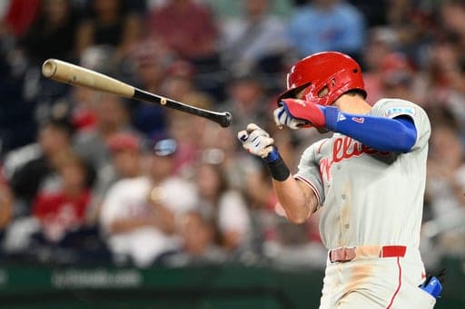Philadelphia Phillies' Trea Turner loses his bat during his at bat in the fourth inning of a baseball game against the Washington Nationals, Wednesday, Sept. 16, 2026, in Washington. (AP Photo/Nick Wass) (AP Photo/Nick Wass)