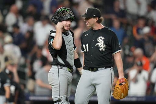 Chicago White Sox catcher Kyle Teel, left, and relief pitcher Grant Taylor (31) celebrate after Game 1 of baseball's American League Wild Card Series against the Houston Astros, Tuesday, Sept. 29, 2026, in Houston. (AP Photo/Karen Warren (AP Photo/Karen Warren)
