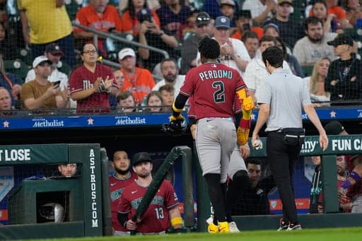 Arizona Diamondbacks' Geraldo Perdomo (2) leaves the game after being hit by a line drive during the third inning of a baseball game against the Houston Astros Sunday, Sept. 6, 2026, in Houston. (AP Photo/David J. Phillip) (AP Photo/David J. Phillip)