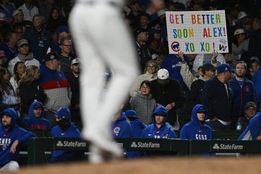 A fan holds a sign supporting Chicago Cubs' Alex Bregman during a baseball game against the Miami Marlins Tuesday, Sept. 22, 2026, in Chicago. (AP Photo/Paul Beaty) (AP Photo/Paul Beaty)