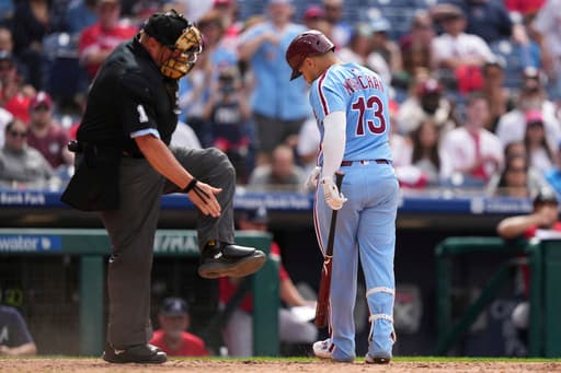 Marchan leads Harper-less Phillies over Braves 5-4 in doubleheader opener for 23rd win in 29 games