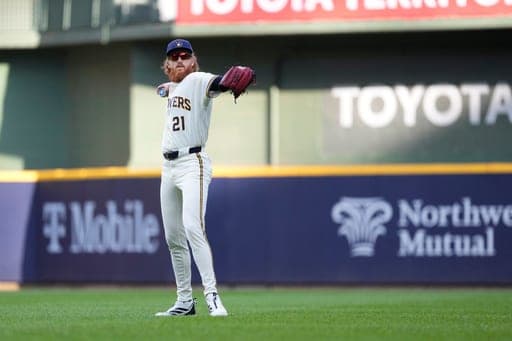 Milwaukee Brewers' Dustin May warms up before a baseball game against the Seattle Mariners, Wednesday, Aug. 19, 2026, in Milwaukee. (AP Photo/Aaron Gash) (AP Photo/Aaron Gash)