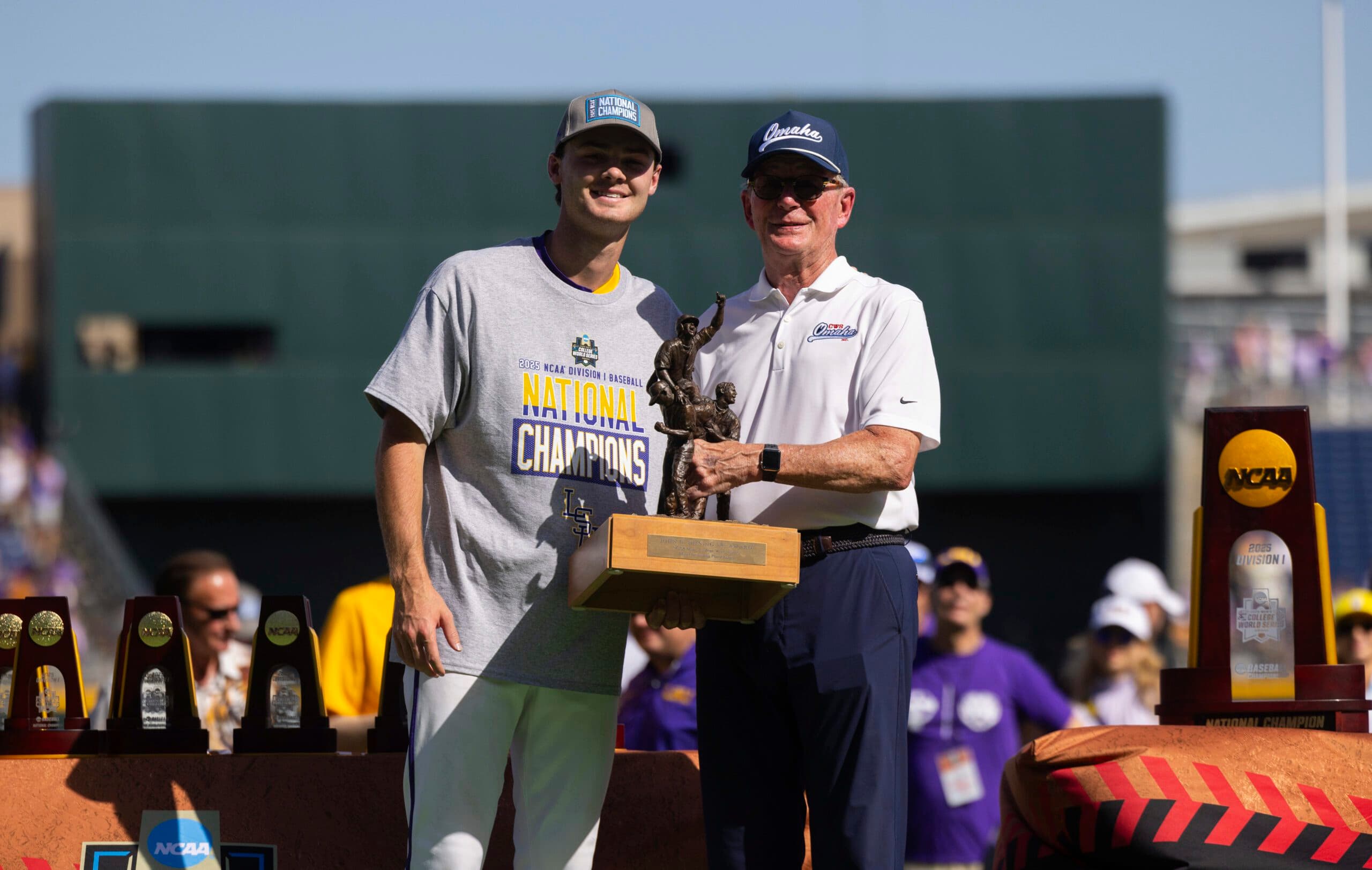 Jack Diesing, Jr., right, presents the John Diesing, Sr., Most Outstanding Player award to LSU pitcher Kade Anderson following their win against Coastal Carolina in Game 2 of the NCAA College World Series baseball finals in Omaha, Neb., Sunday, June 22, 2025.