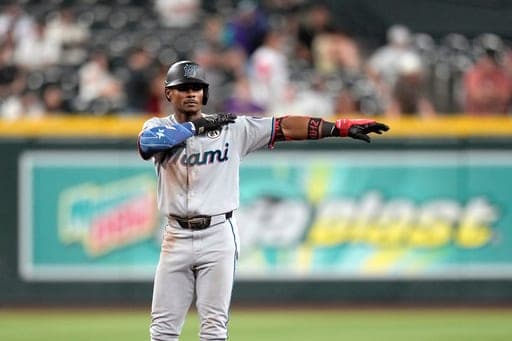 Miami Marlins' Esteury Ruiz celebrates his three-run double against the Arizona Diamondbacks during the 11th inning of a baseball game, Tuesday, Sept. 15, 2026, in Phoenix. (AP Photo/Ross D. Franklin) (AP Photo/Ross D. Franklin)