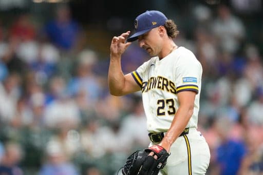 Milwaukee Brewers pitcher Brandon Sproat walks off the field after being taken out of the game during the ninth inning of a baseball game against the Chicago Cubs Wednesday, Sept. 9, 2026, in Milwaukee. (AP Photo/Kayla Wolf) (AP Photo/Kayla Wolf)