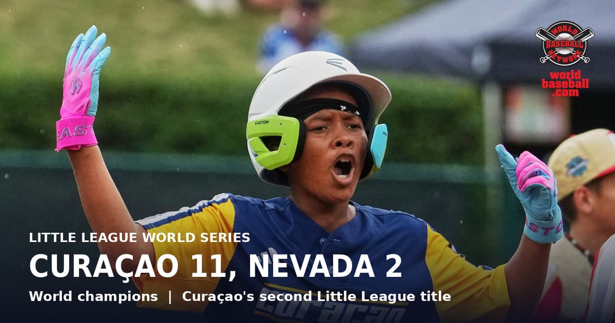 Curaçao's Juriënsly De Windt raises both arms in celebration after his three-run double in the fifth inning of the Little League World Series championship game
