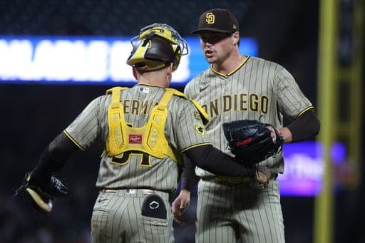 San Diego Padres pitcher Mason Miller, right, celebrates with San Diego Padres catcher Freddy Fermin (54) after their team's victory against the San Francisco Giants during a baseball game in San Francisco, Friday, Sept. 11, 2026. (AP Photo/Jed Jacobsohn) (AP Photo/Jed Jacobsohn)