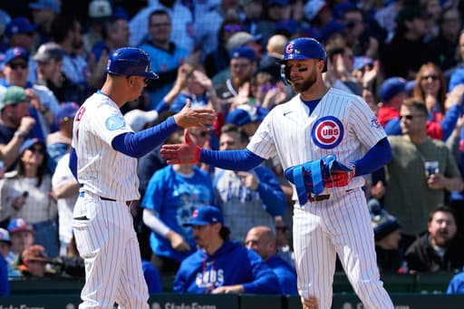 Busch stars as the surging Cubs beat the Diamondbacks 8-4 for their 5th consecutive win