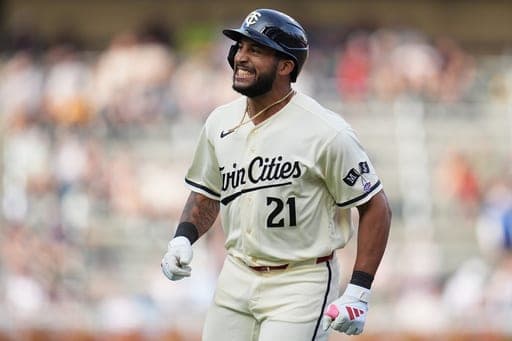Minnesota Twins' Emmanuel Rodriguez jogs back to the dugout after hitting a flyout during the bottom of the eighth inning of his major league debut during a baseball game against the Cleveland Guardians, Saturday, Sept. 12, 2026, in Minneapolis. (AP Photo/Abbie Parr) (AP Photo/Abbie Parr)