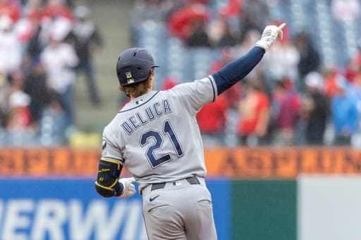 Tampa Bay Rays' Jonny DeLuca gestures at second base after hitting a solo home run in the fifth inning of a baseball game against the Philadelphia Phillies, Sunday, Sept. 27, 2026, in Philadelphia. (AP Photo/Laurence Kesterson) (AP Photo/Laurence Kesterson)