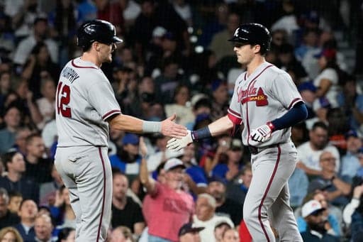 Atlanta Braves' Mike Yastrzemski, right, celebrates with Sean Murphy, left, after hitting a two-run home run during the seventh inning of a baseball game against the Chicago Cubs in Chicago, Monday, Sept. 14, 2026. (AP Photo/Nam Y. Huh) (AP Photo/Nam Y. Huh)