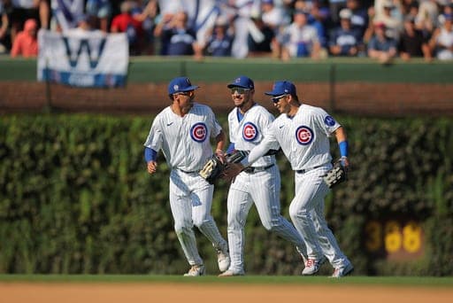 Chicago Cubs outfielders, from left, Tyrone Taylor, Michael Conforto and Seiya Suzuki celebrate after a baseball game against the Pittsburgh Pirates, Friday, Sept. 11, 2026, in Chicago. (AP Photo/Melissa Tamez) (AP Photo/Melissa Tamez)