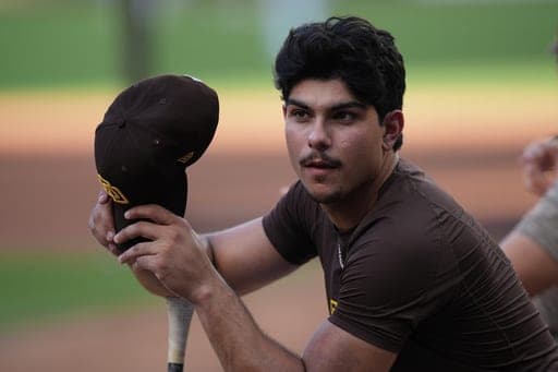 San Diego Padres catcher Ethan Salas looks on before Game 1 of the National League Wild Card baseball playoff series against the Chicago Cubs Tuesday, Sept. 29, 2026, in San Diego. (AP Photo/Gregory Bull) (AP Photo/Gregory Bull)
