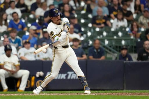 Milwaukee Brewers' Joey Ortiz hits an RBI single during the eighth inning of a baseball game against the Seattle Mariners, Wednesday, Aug. 19, 2026, in Milwaukee. (AP Photo/Aaron Gash) (AP Photo/Aaron Gash)