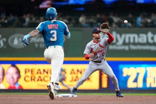 St. Louis Cardinals' Masyn Winn catches the ball to force Milwaukee Brewers' Joey Ortiz out at second base during a baseball game Friday, Sept. 25, 2026, in Milwaukee. (AP Photo/Aaron Gash) (AP Photo/Aaron Gash)