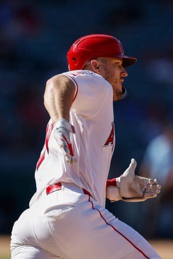 Los Angeles Angels designated hitter Mike Trout rounds first base after hitting an RBI double during the ninth inning of a baseball game against the Philadelphia Phillies, Sunday, Aug. 30, 2026, in Anaheim, Calif. (AP Photo/Caroline Brehman) (AP Photo/Caroline Brehman)