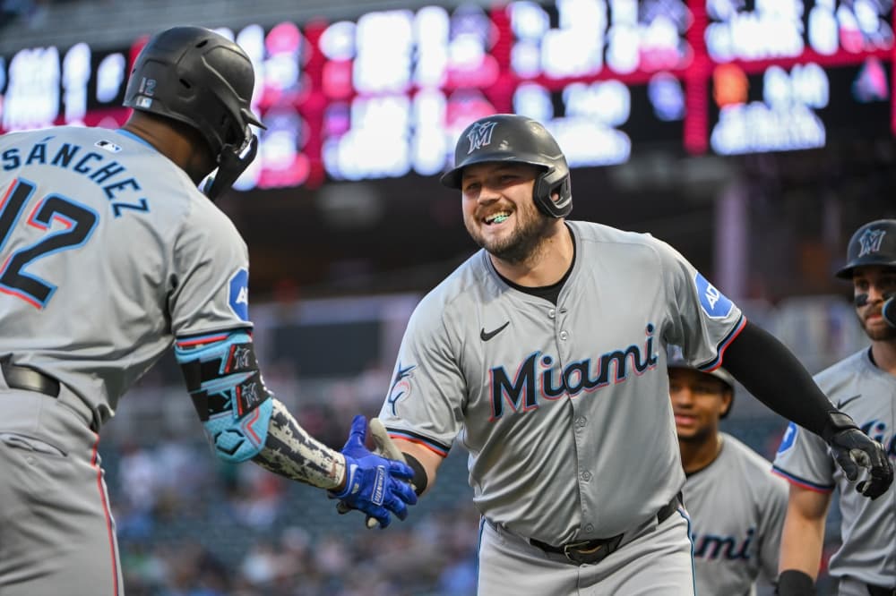 Rangers get slugging corner infielder Jake Burger from Marlins for prospects and sign a reliever