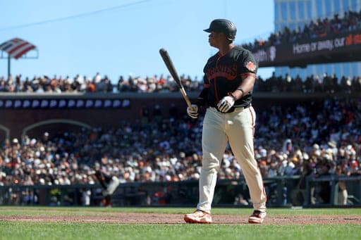 San Francisco Giants' Rafael Devers walks back to the dugout after striking out during the eighth inning of a baseball game against the San Diego Padres in San Francisco, Saturday, Sept. 12, 2026. (AP Photo/Jed Jacobsohn) (AP Photo/Jed Jacobsohn)