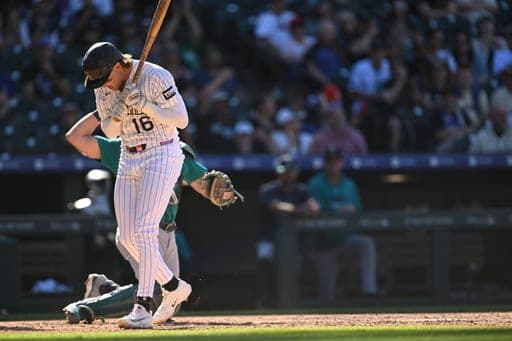 Colorado Rockies' Cole Carrigg (16) reacts after striking out in the ninth inning against the Seattle Mariners during a baseball game Sunday, Sept. 20, 2026, in Denver. (AP Photo/RJ Sangosti) (AP Photo/RJ Sangosti)