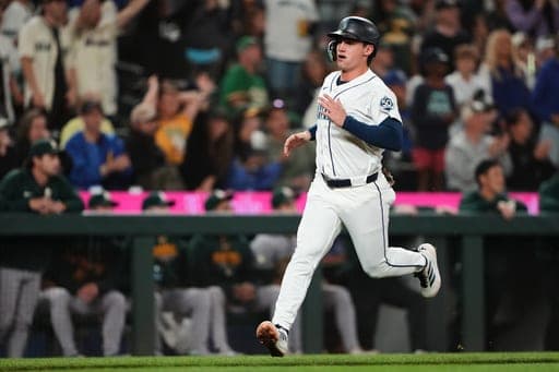 Seattle Mariners' Cole Young runs home to score on an RBI single from Dominic Canzone during the eighth inning of a baseball game against the Athletics, Saturday, Sept. 5, 2026, in Seattle. (AP Photo/Lindsey Wasson) (AP Photo/Lindsey Wasson)