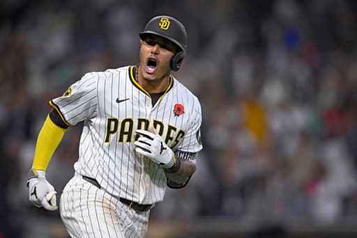 Machado hits tying homer in 8th inning and Padres come back to beat Marlins 4-3 in 11