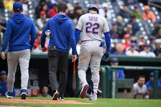 New York Mets' Juan Soto (22) walks back to the dugout after he was hit by a pitch by Washington Nationals pitcher Richard Lovelady during the ninth inning of a baseball game, Saturday, Sept. 26, 2026, in Washington. (AP Photo/Nick Wass) (AP Photo/Nick Wass)
