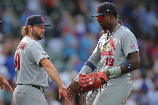 St. Louis Cardinals' Alec Burleson, left, and Jordan Walker, right, celebrate after a baseball game against the Chicago Cubs, Sunday, Aug. 16, 2026, in Chicago. (AP Photo/Melissa Tamez) (AP Photo/Melissa Tamez)