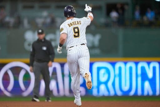 Milwaukee Brewers' Jake Bauers reacts after hitting a home run during the seventh inning of a baseball game against the Cincinnati Reds, Sunday, Sept. 13, 2026, in Milwaukee. (AP Photo/Kayla Wolf) (AP Photo/Kayla Wolf)