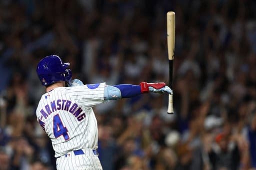 Chicago Cubs' Pete Crow-Armstrong tosses his bat after hitting a walkoff home run during the 10th inning of a baseball game to defeat the Chicago White Sox in Chicago, Monday, Aug. 17, 2026. (AP Photo/Jessie Alcheh) (AP Photo/Jessie Alcheh)