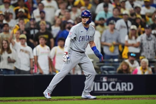 Chicago Cubs Seiya Suzuki leads off third base in the 9th inning against the San Diego Padres in Game 1 of the National League Wild Card baseball playoff series Tuesday, Sept. 29, 2026, in San Diego. (AP Photo/Gregory Bull) (AP Photo/Gregory Bull)