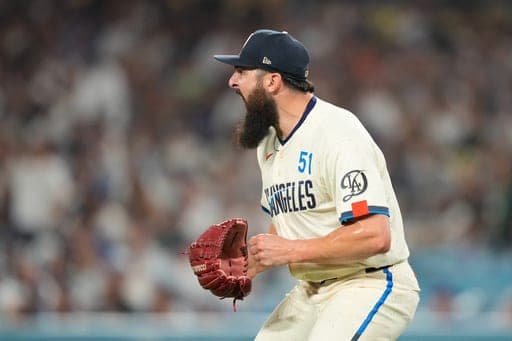 Los Angeles Dodgers pitcher Alex Vesia celebrates as a ball hit by San Francisco Giants' Jung Hoo Lee is caught to end the top of the seventh inning of a baseball game Saturday, Sept. 19, 2026, in Los Angeles. (AP Photo/Mark J. Terrill) (AP Photo/Mark J. Terrill)
