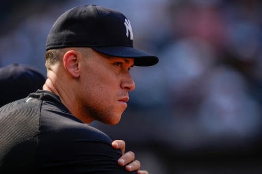 New York Yankees' Aaron Judge watches from the dugout during the ninth inning of a baseball game against the Seattle Mariners, Thursday, Aug. 13, 2026, in New York. (AP Photo/Yuki Iwamura) (AP Photo/Yuki Iwamura)