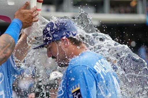 Kansas City Royals' Vinnie Pasquantino is doused by teammates after their baseball game against the Cleveland Guardians, Sunday, Sept. 27, 2026, in Kansas City, Mo. (AP Photo/Charlie Riedel) (AP Photo/Charlie Riedel)