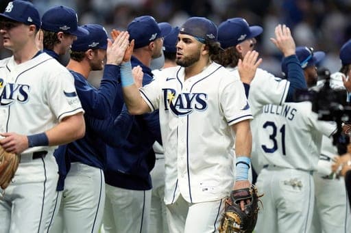 Tampa Bay Rays first baseman Jonathan Aranda, center, celebrates with teammates after their 1-0 win over the New York Yankees in Game 1 of an American League Division Series baseball game Saturday, Oct. 3, 2026, in St. Petersburg, Fla. (AP Photo/Chris O'Meara) (AP Photo/Chris O'Meara)