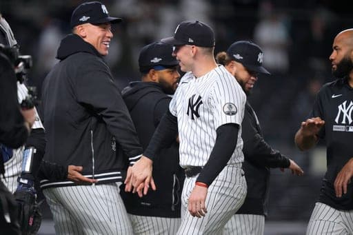 New York Yankees' Ben Rice, right, reacts with teammate Aaron Judge after their team defeated the Boston Red Sox 9-0 in Game 1 of baseball's American League Wild Card Series, Tuesday, Sept. 29, 2026, in New York. (AP Photo/Yuki Iwamura) (AP Photo/Yuki Iwamura)