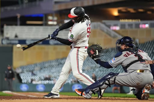 Josh Bell homers twice as Twins beat Astros 6-3 in game delayed nearly 2 hours by rain